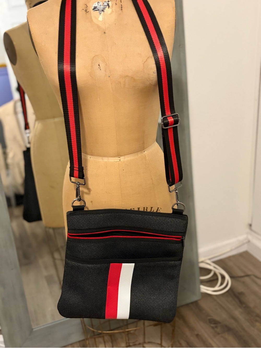 HAUTE SHORE Black Crossbody with Red & White Center Stripe
